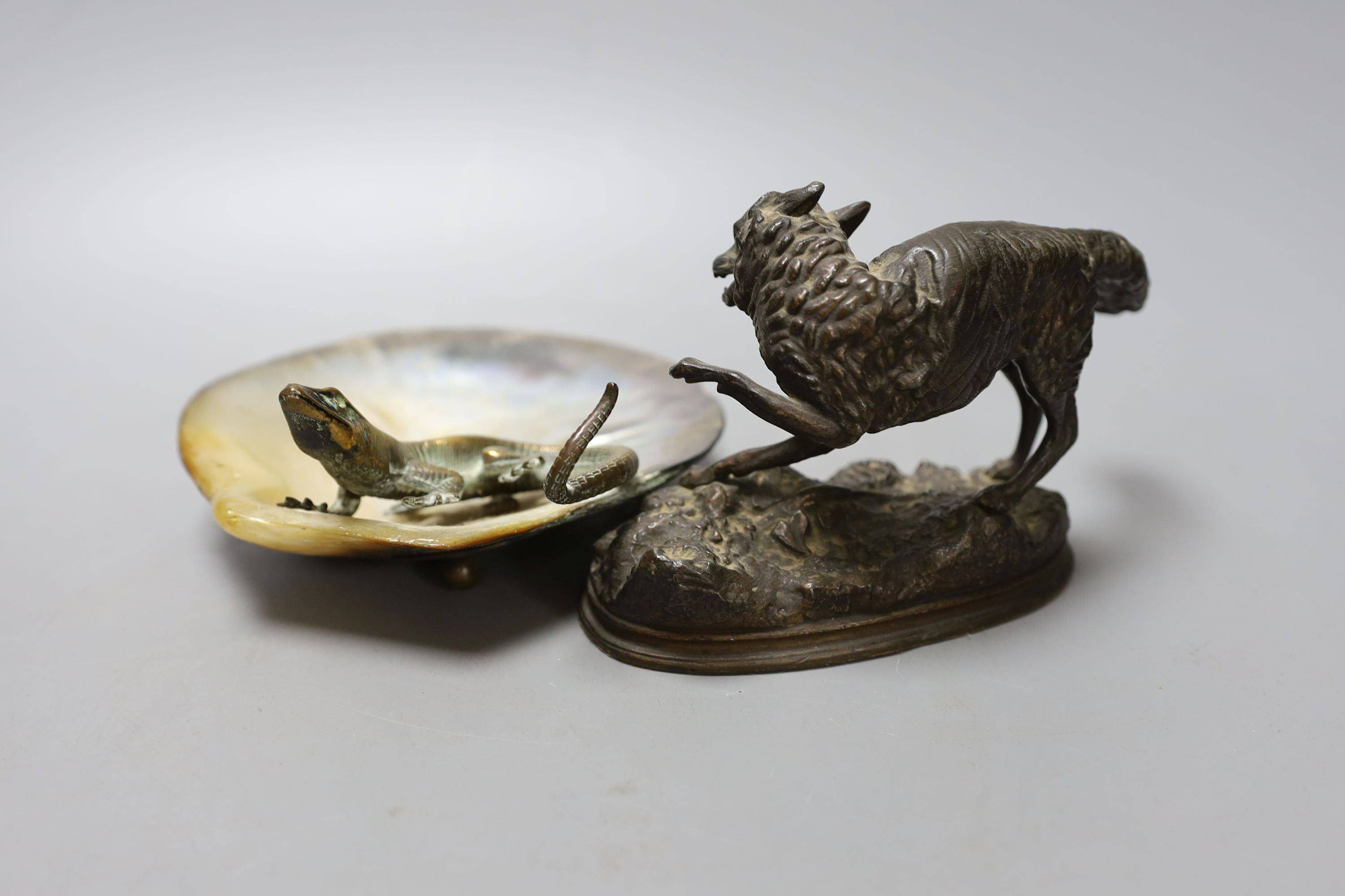 A bronze and mother-of-pearl 'lizard' dish, a bronzed spelter fox, 15cm long and two cold painted spelter parrots